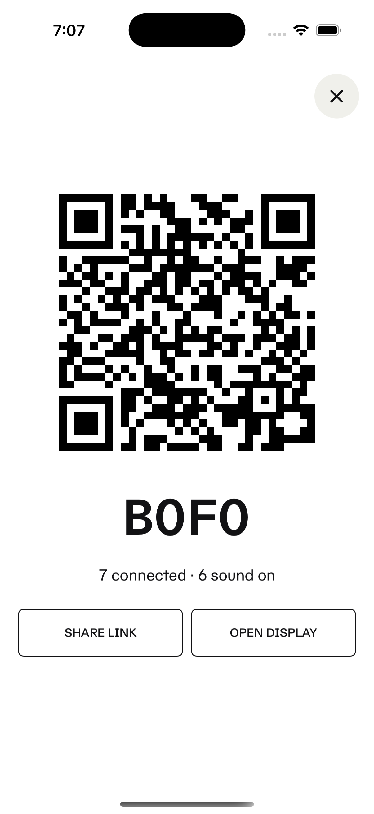 Meetings room-access screen with a QR code and room code